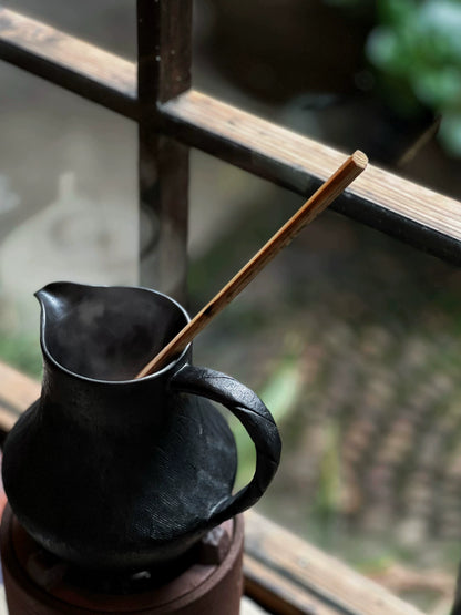 How many handmade coffee sharing pots and milk teapots in the black pottery area