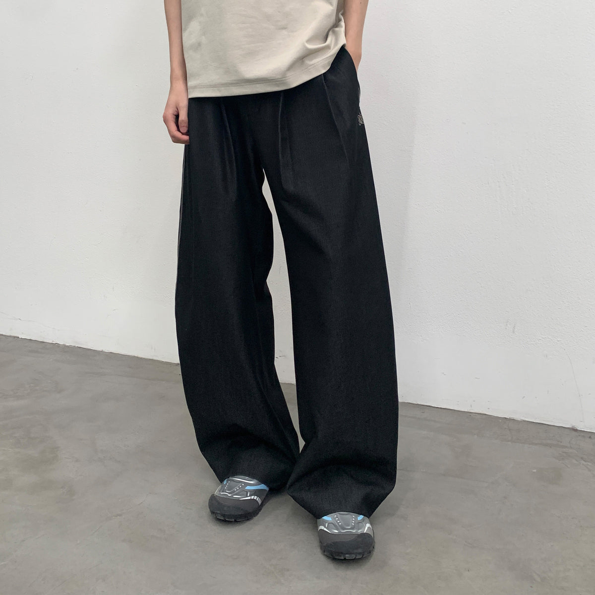 RoaringWild A Arch Roaring Beast draped wide-leg pants with scimitar design men's casual pants