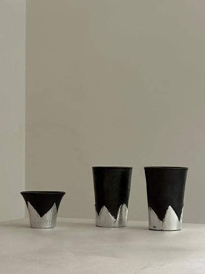 Many black pottery handmade silver-leaf snow mountain cups