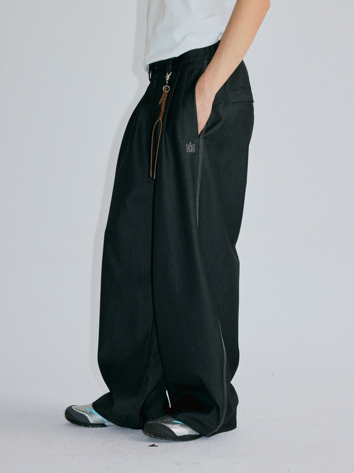 RoaringWild A Arch Roaring Beast draped wide-leg pants with scimitar design men's casual pants