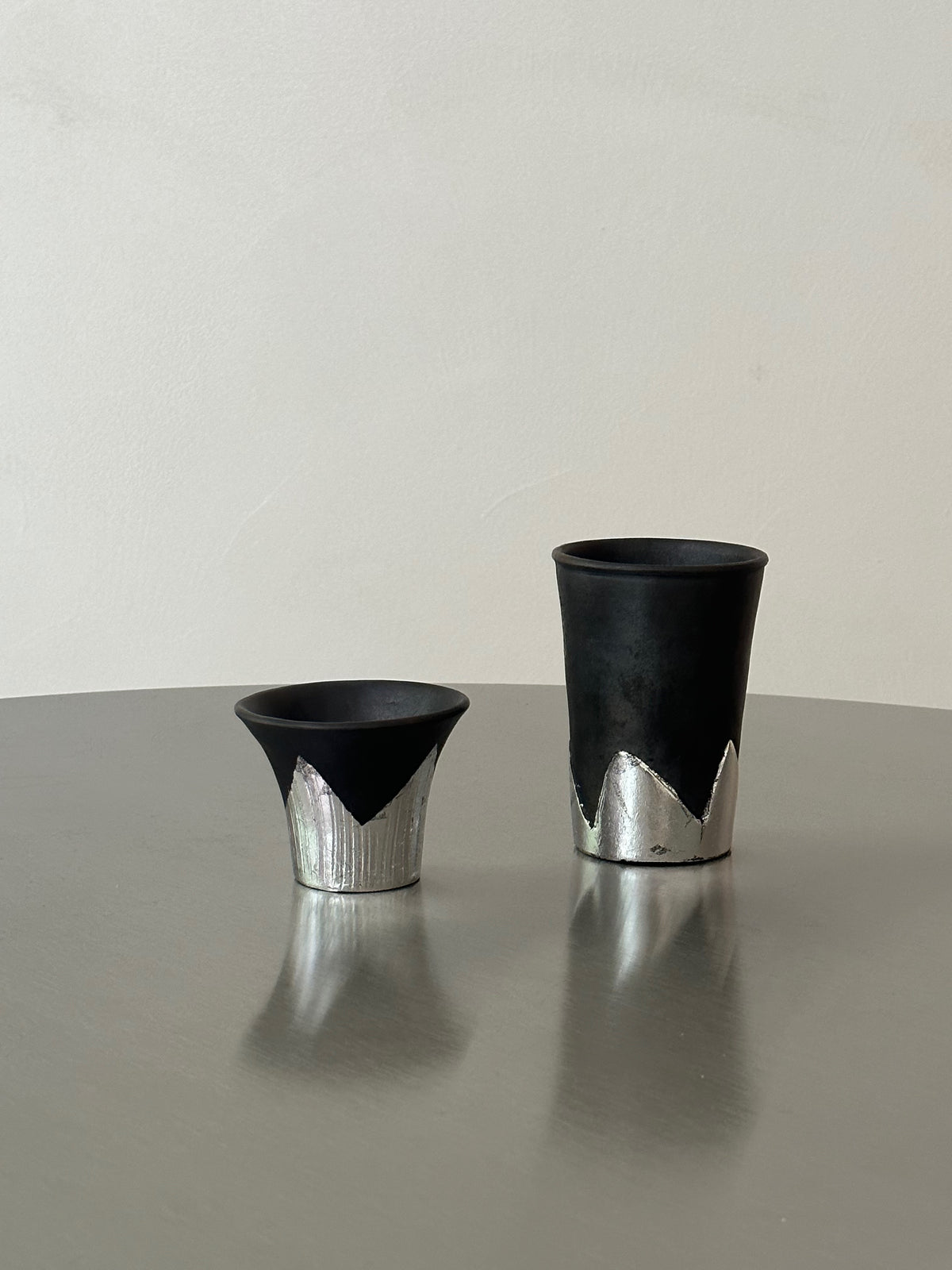 Many black pottery handmade silver-leaf snow mountain cups