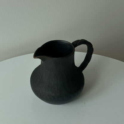 How many handmade coffee sharing pots and milk teapots in the black pottery area