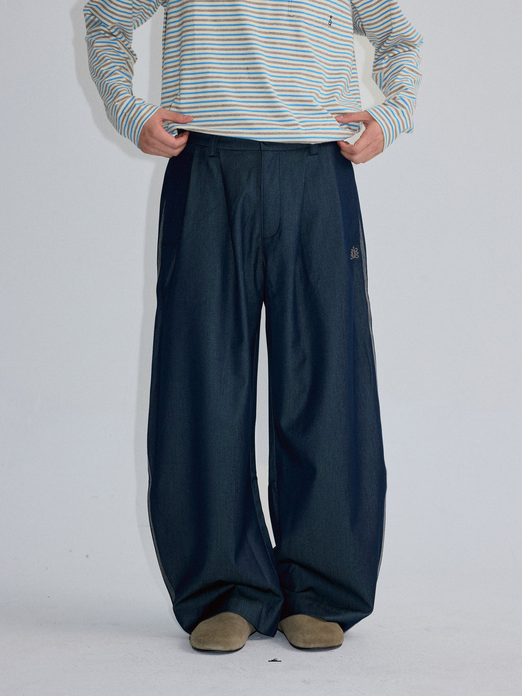RoaringWild A Arch Roaring Beast draped wide-leg pants with scimitar design men's casual pants